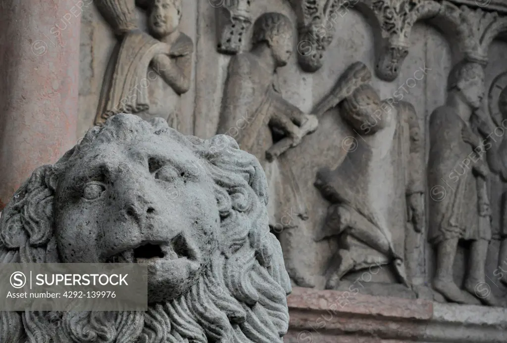 Modena, Italy, lion statue and bas-relief at the entrance of the San Geminianos Cathedral