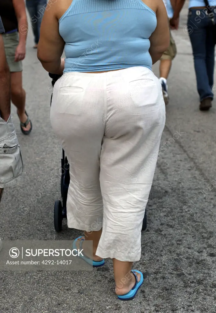 Fat woman walking on the street