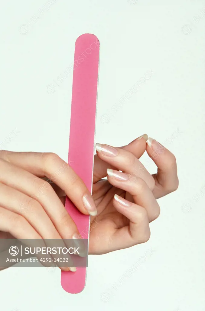 Woman filing nails