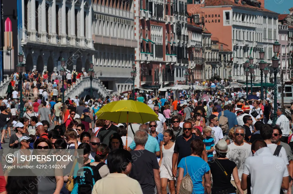 Venezia, Italy, crowd of tourists in August along the Riva degli Schiavoni