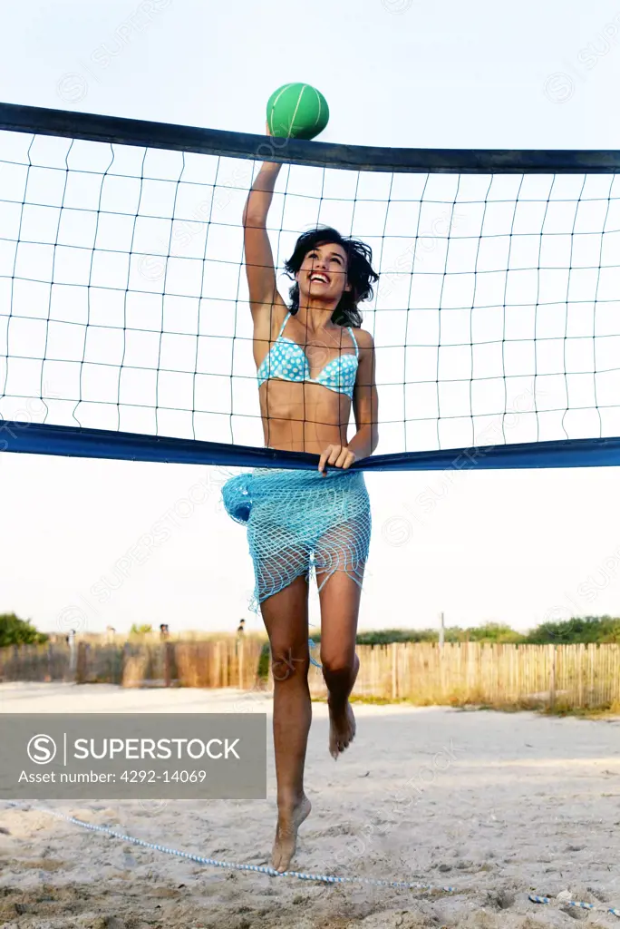 Woman playing volleyball on the beach
