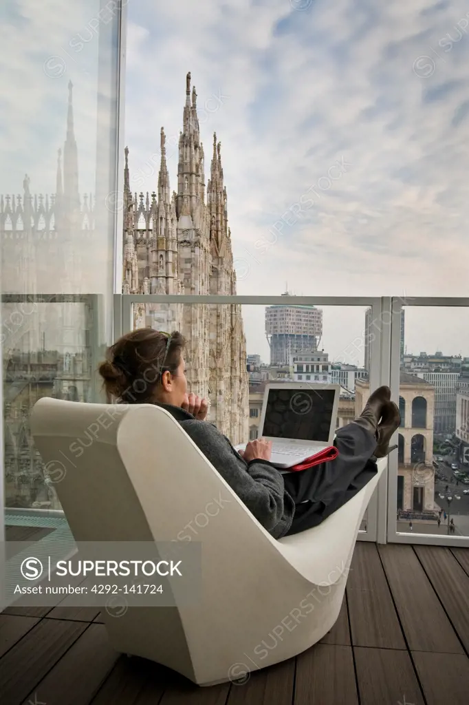 Woman with computer, The Cube, Milan, Italy