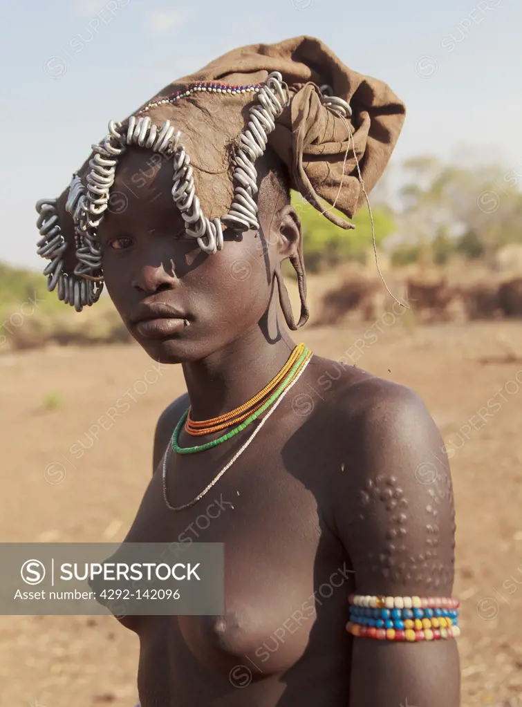 Africa, Ethiopia, Omo Valley, Mursi tribe young woman close up