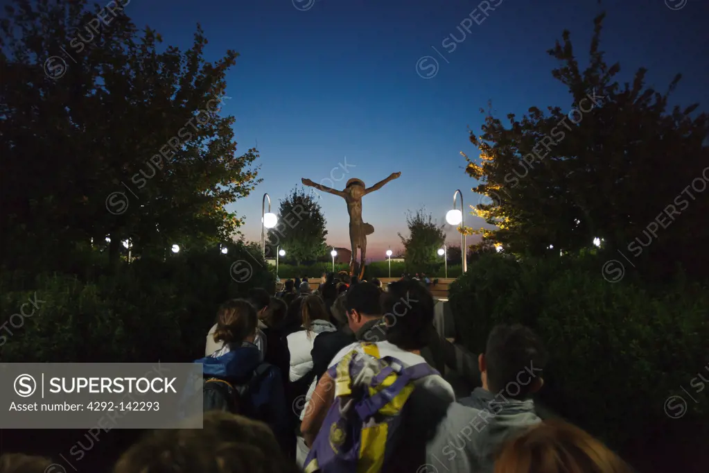 Bosnia and Herzegovina, Medjugorje, catholic pilgrims praying at a cross at night