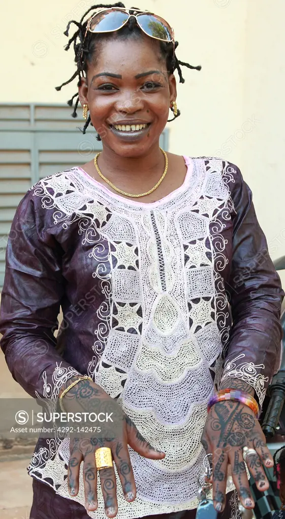 malian woman in wedding party with tipical henne tattoo on her hands, Segou, Mali