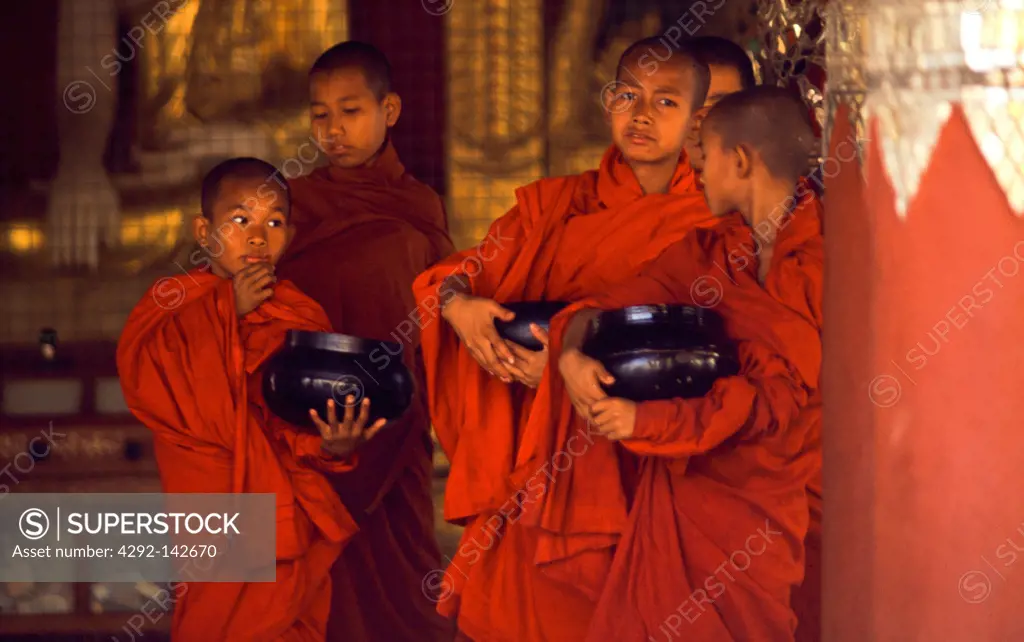 Myanmar, Rangoon Burma children monks go to get rice offering in the SHWEDAGON PAGODA