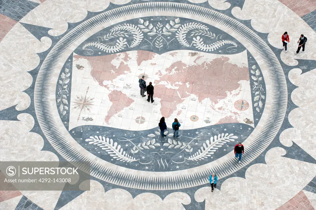 Tourists on a giant world map at the foot of the Monument to the Discoveries, Padrao dos Descobrimentos, Belem, Lisbon, Portugal, Europe