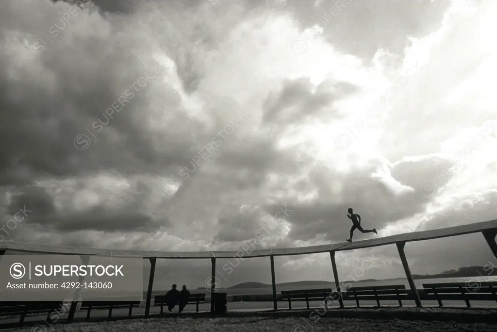 Male Athlete Running on Track