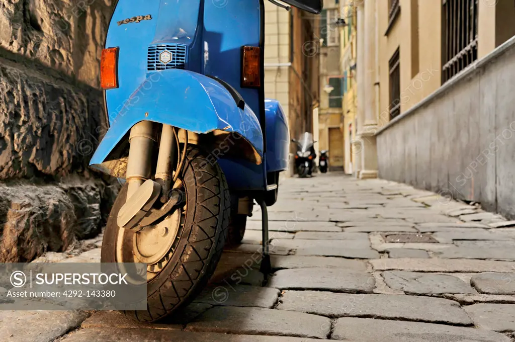Italy, Liguria, Genoa, scooter vespa in old alleys (called vicoli) in historical centre