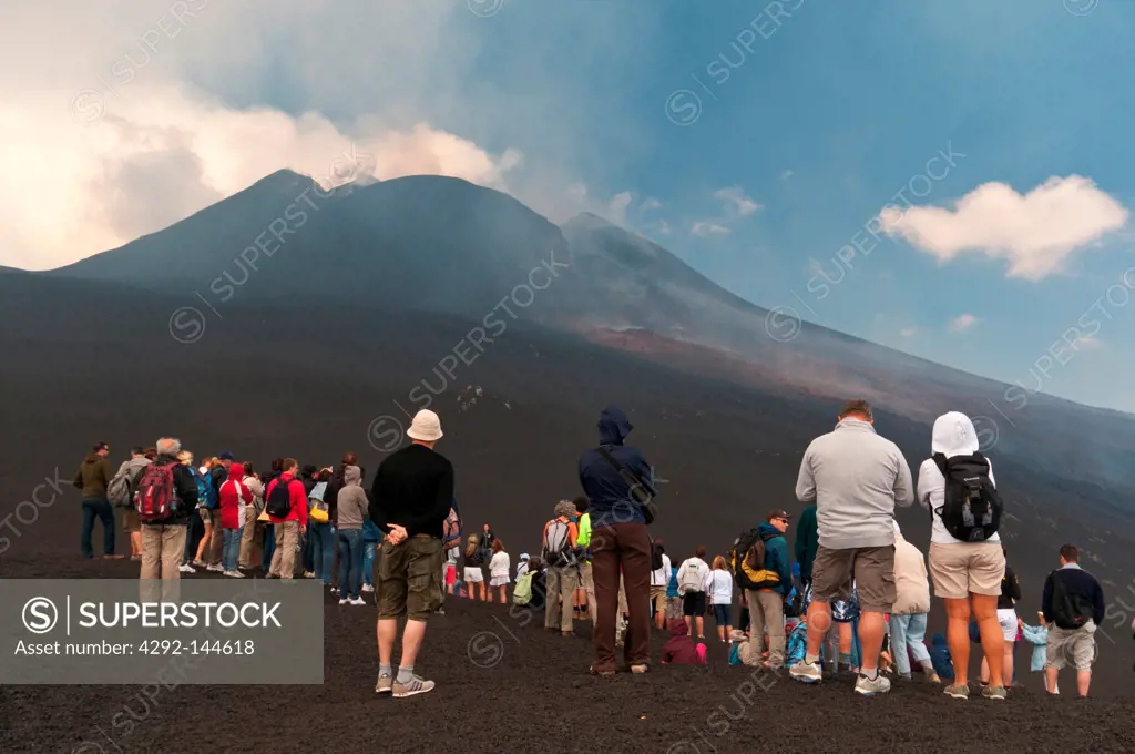 Italy, Sicily, Tourist on the Etna volcano view the eruptione