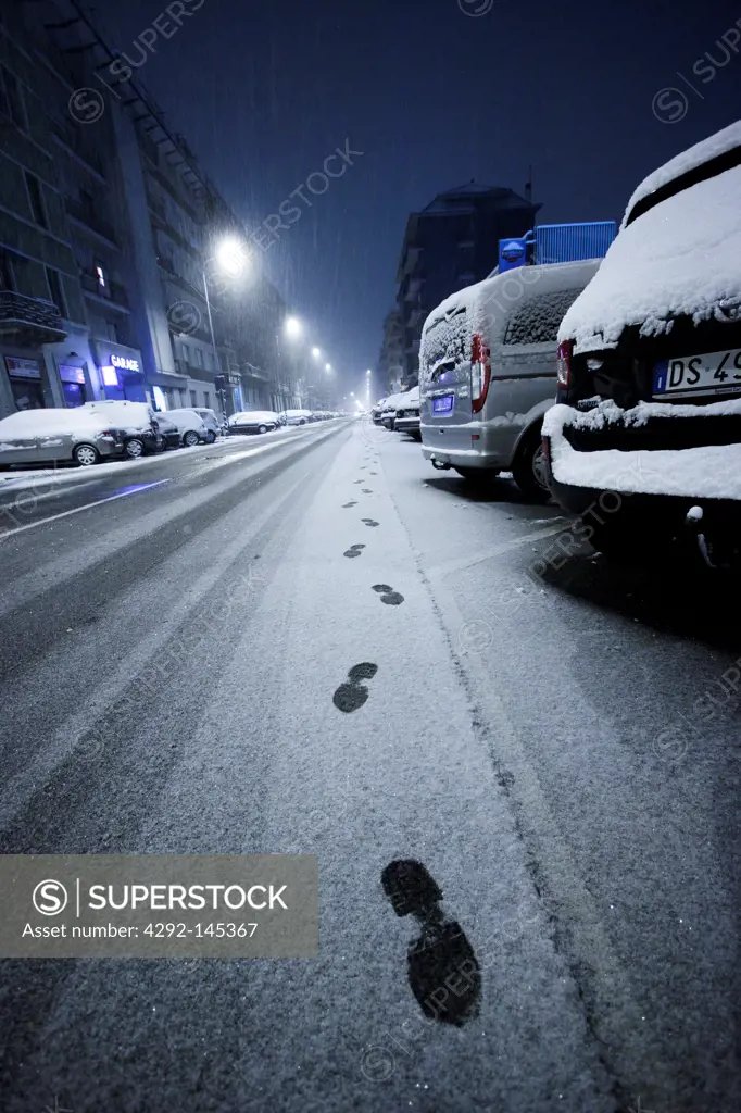 footprints in the snow in the city
