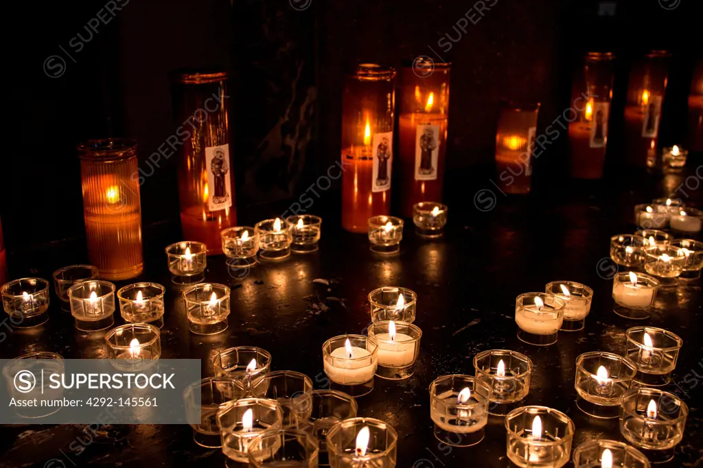 Italy, Lombardy, Milan, candles in Sant'Antonio da Padova church