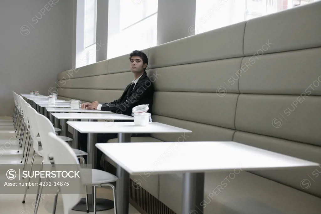 Young man sitting in a cafe