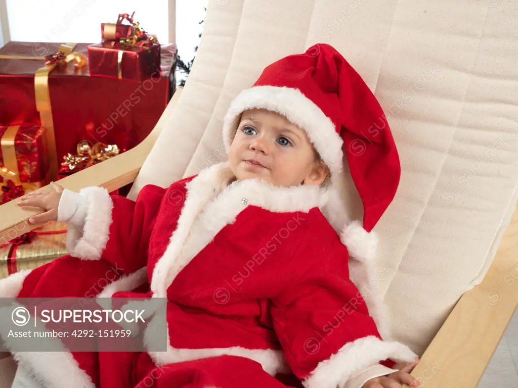 baby girl dressed as father christmas