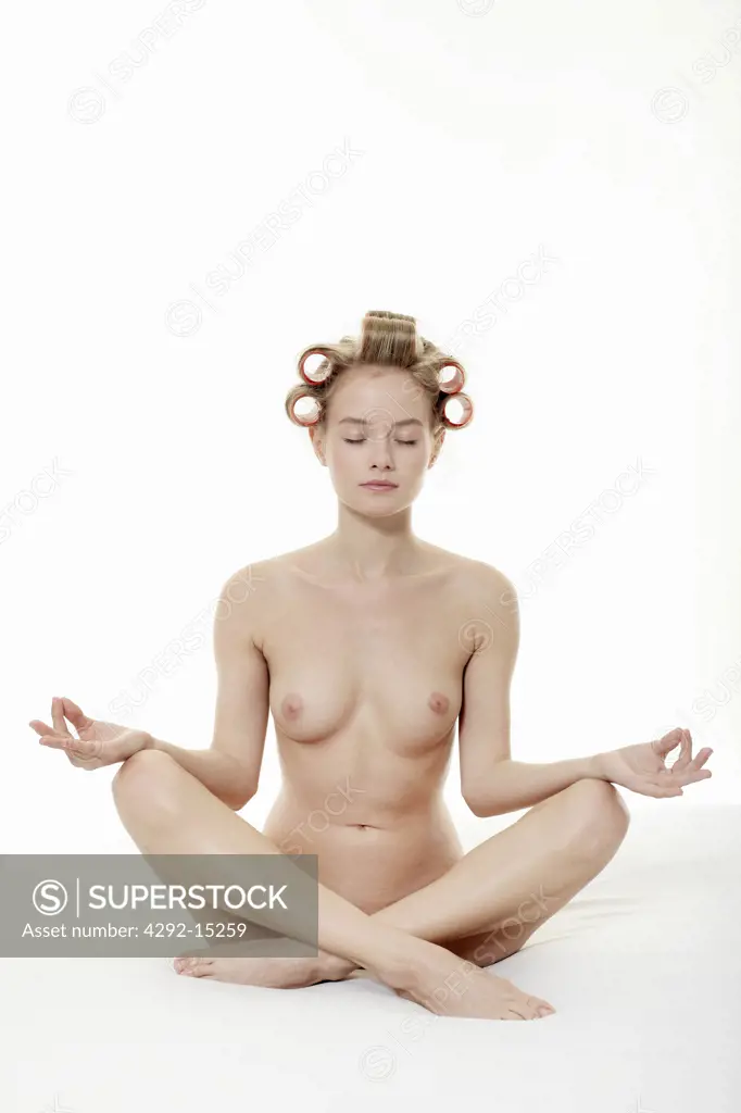 Portrait of a naked woman doing yoga