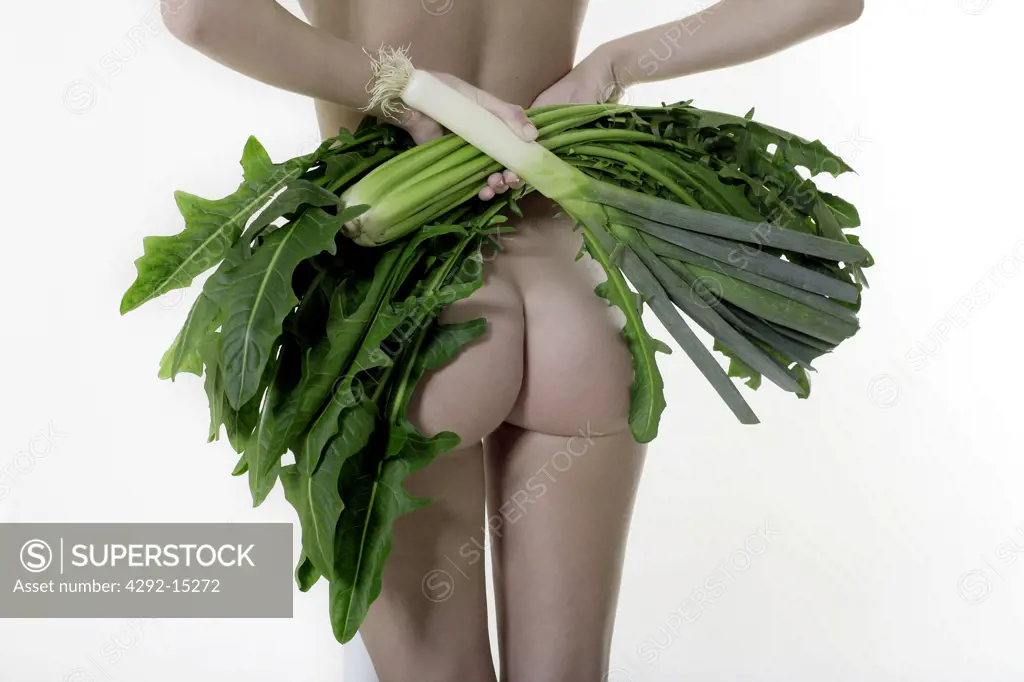 Naked woman with vegetables