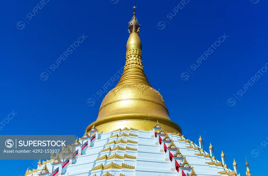 Myanmar, Bago, the white square pillar of the Kyaik Pun Paya Pagoda.