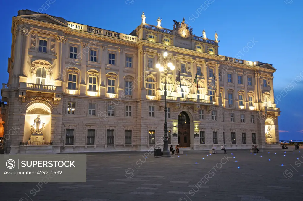 Italy, Friuli Venezia Giulia, Trieste, Piazza d'Italia Square, Lloyd Adriatico Palace at dusk