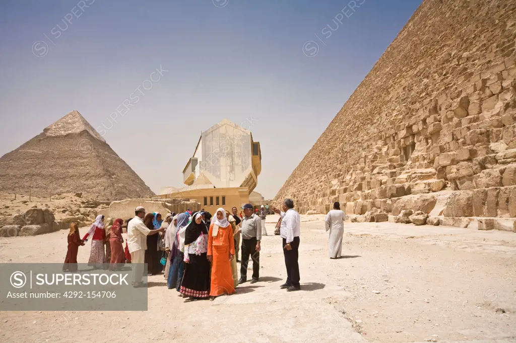 Egypt, Cairo, A group of schoolchildren at the foot of the pyramids