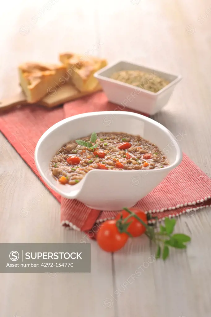 Buckwheat soup with beans, tomatoes, carrots and lentils