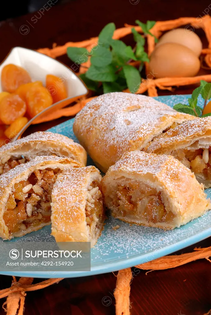 Strudel slices filled with apricot, peach, pine nuts and nut kernels