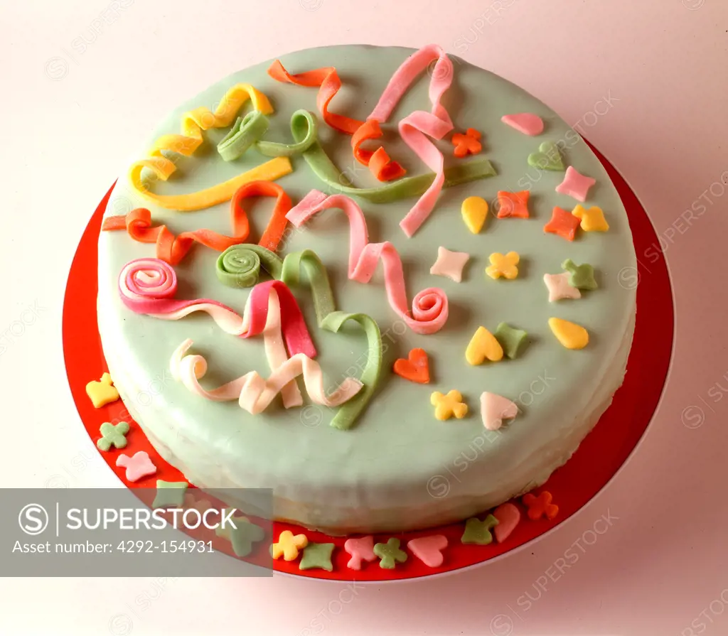 Cake covered with marzipan with marzipan decorations