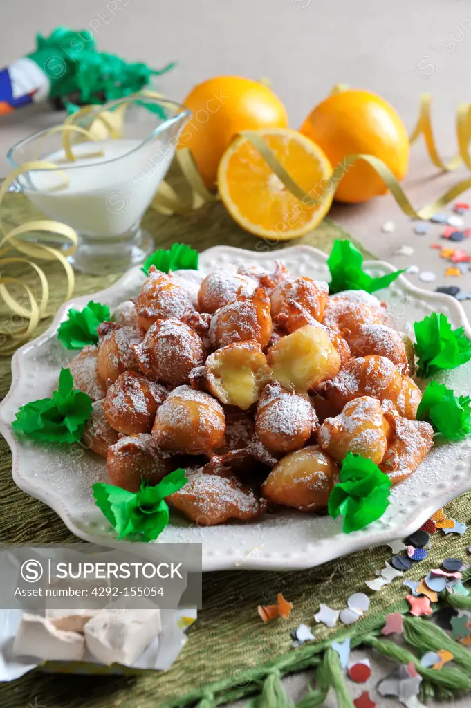 Fritters filled with orange cream
