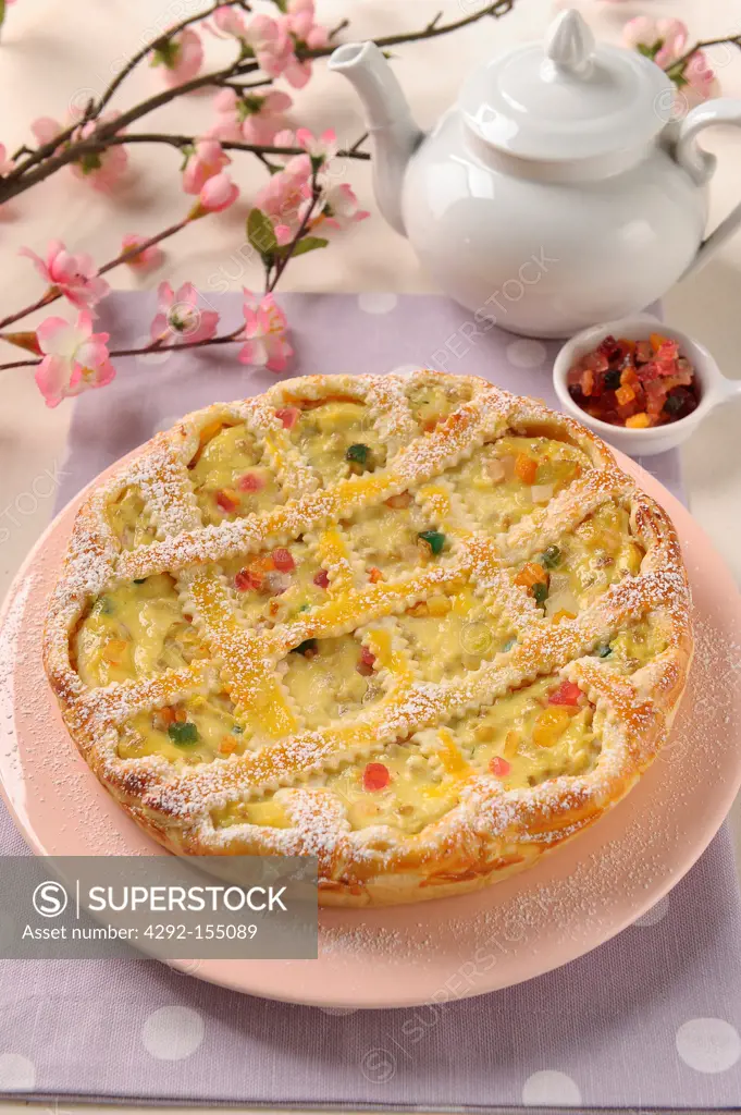 Tart filled with ricotta and stewed corn cream and candied fruits