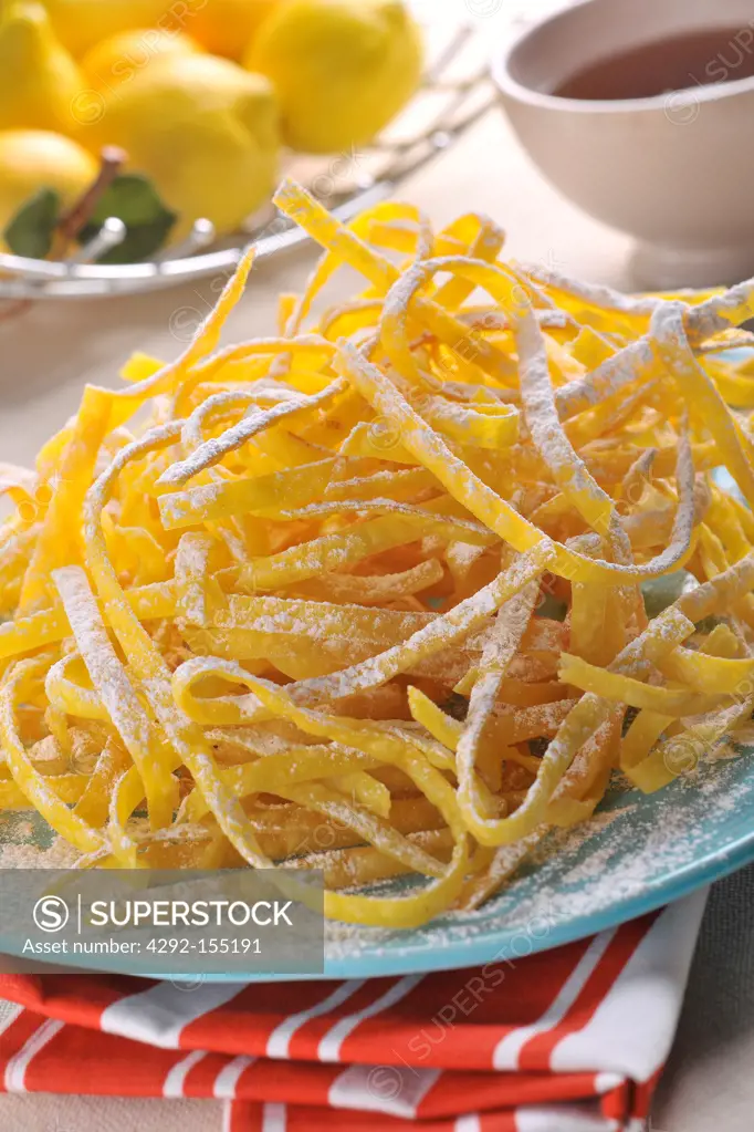 Sweet fried noodles covered with powdered sugar