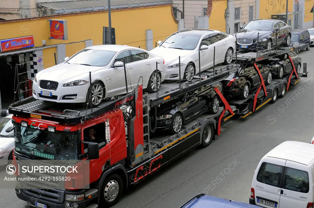 Italy, Lombardy, Milan, truck auto transporter with Rover cars