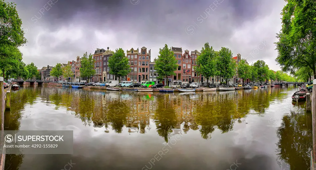 The Netherlands, Amsterdam, buildings mirrored on the canal