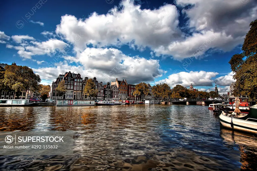 The Netherlands, Amsterdam, Historical buildings, canal, huge sky