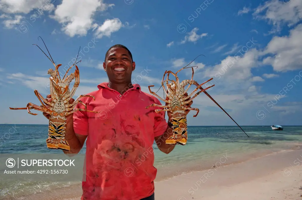 Dominican Republic, national Park de Este, Isla Sahona, fisherman with lobster