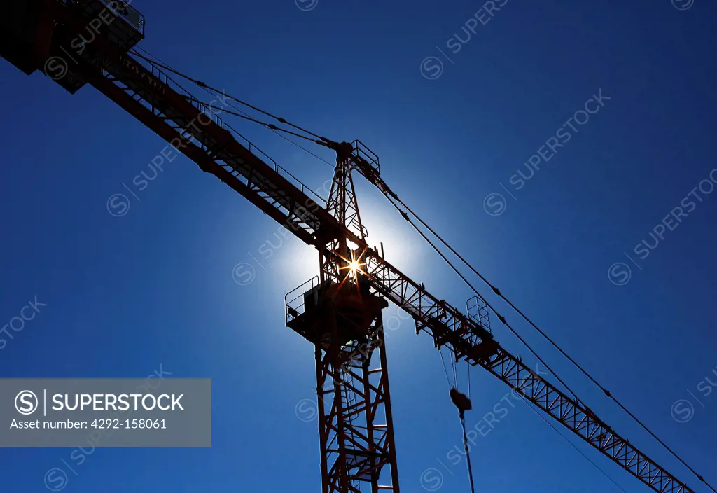 a ray of sunshine through a crane