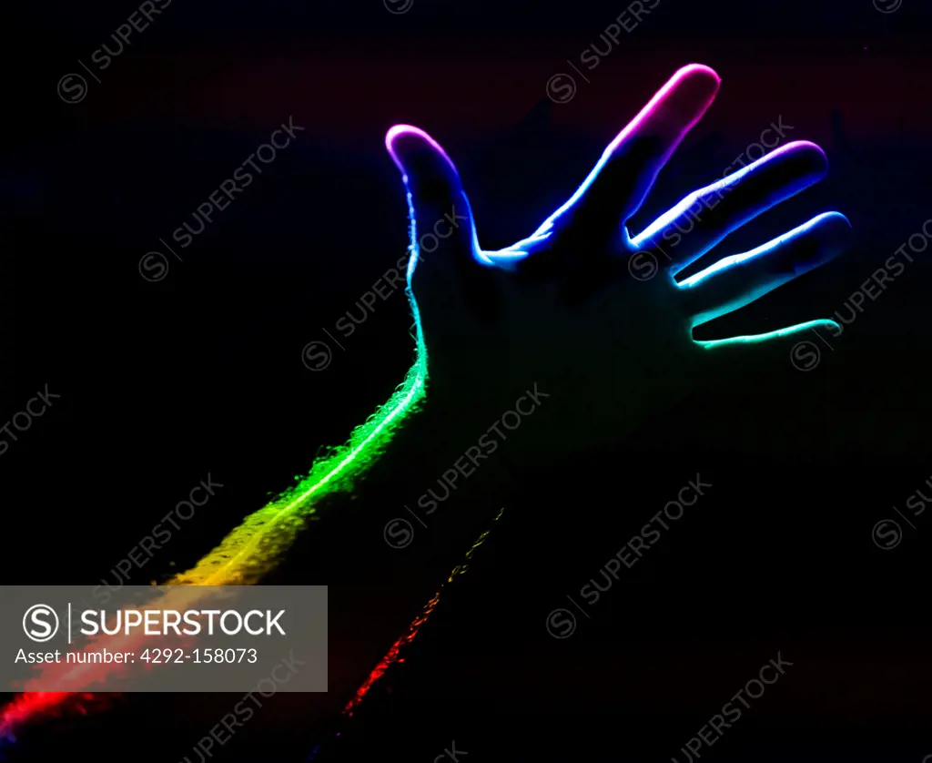 silhouette of a hand with the colors of the rainbow