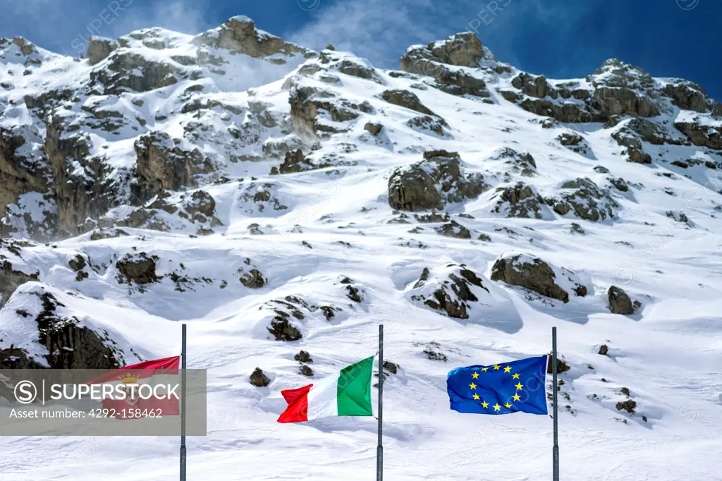 Italy, Dolomites, Trentino Alto Adige, flags in the the Pordoi Pass