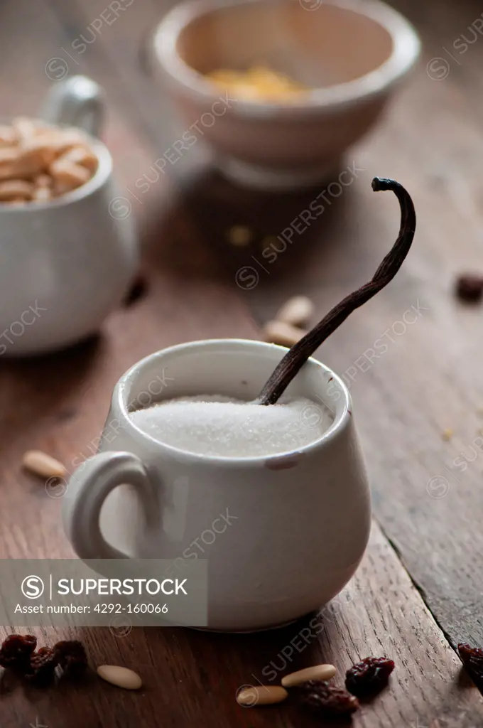 a coffe cap full of sugar and vanilla pod