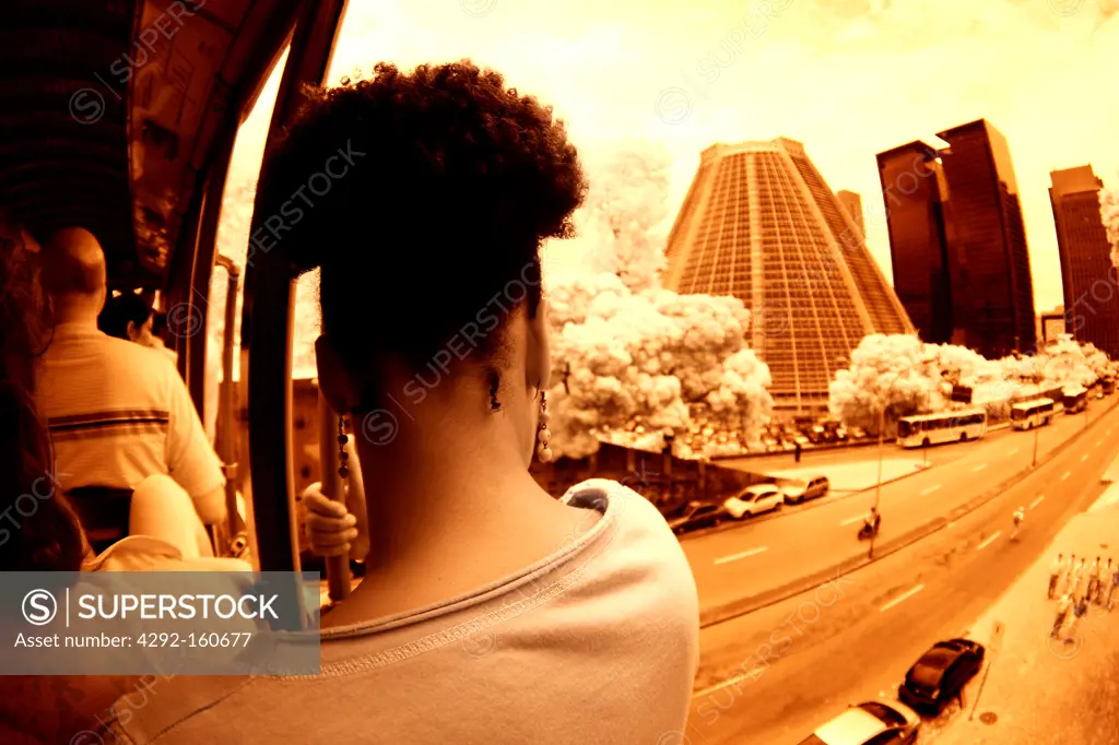 Tress girl looking the town on a bonde - Cachinho, . Bonde, Rio de Janeiro,