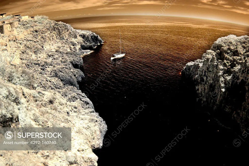 Ship under the sea cliff - Italy