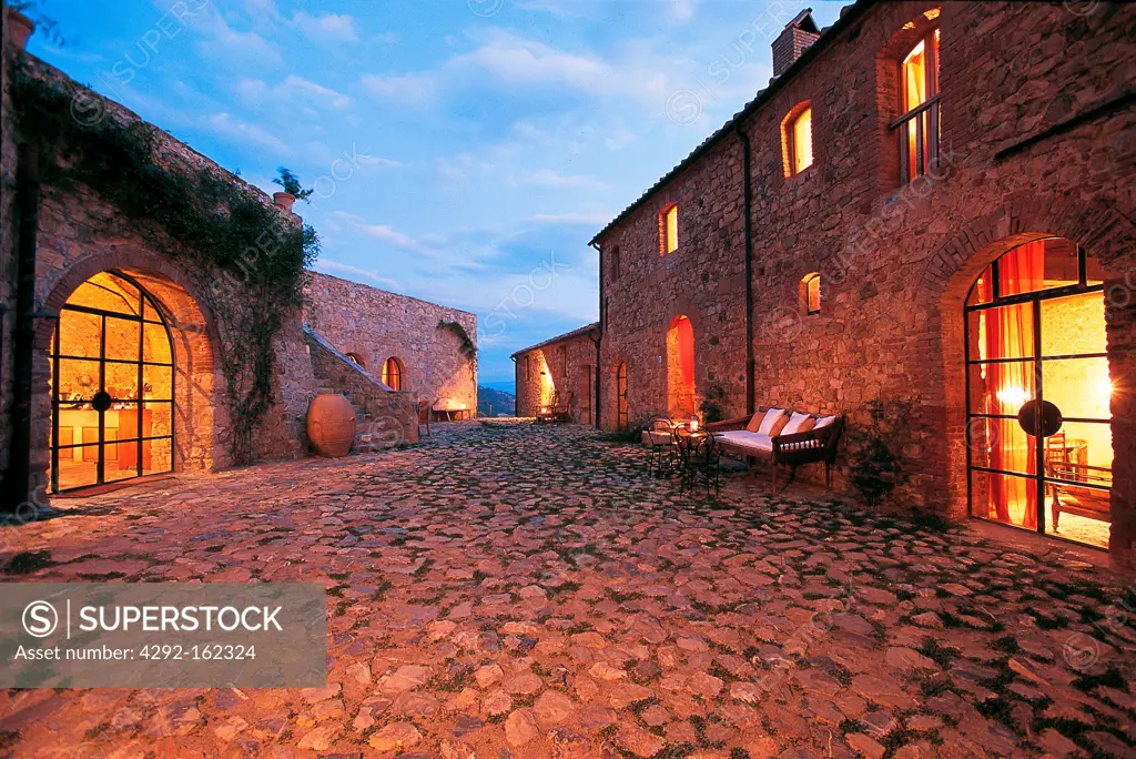 Italy, Tuscany, Cinigiano, Castle of Vicarello, Charming Farm House and resort at dusk