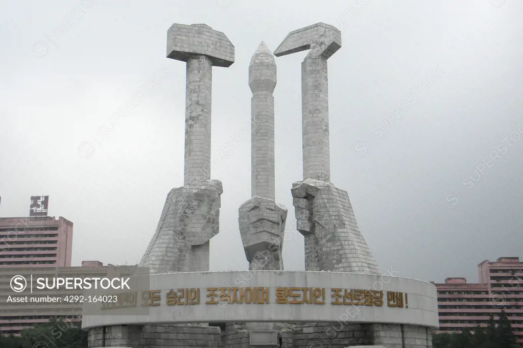 Members of the Korean s workers party are educated at the Monument to Party Foundation which is hands holding a hammer a hoe, Simbol of Koryo, Pyongyang, North Korea