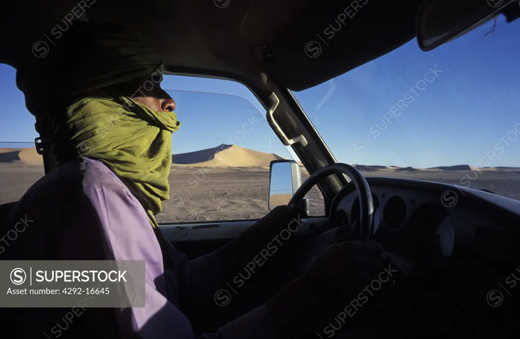Algeria, Sahara, Erg Chech Desert, man in car