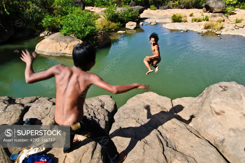 Kids jumping in a pond, Bolaven Plateau, Laos