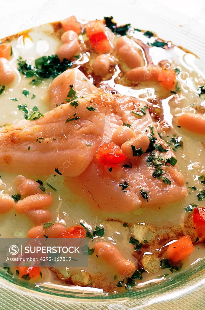 Fresh marinated salmon fillet with cannellini beans, parsley and minced tomatoes