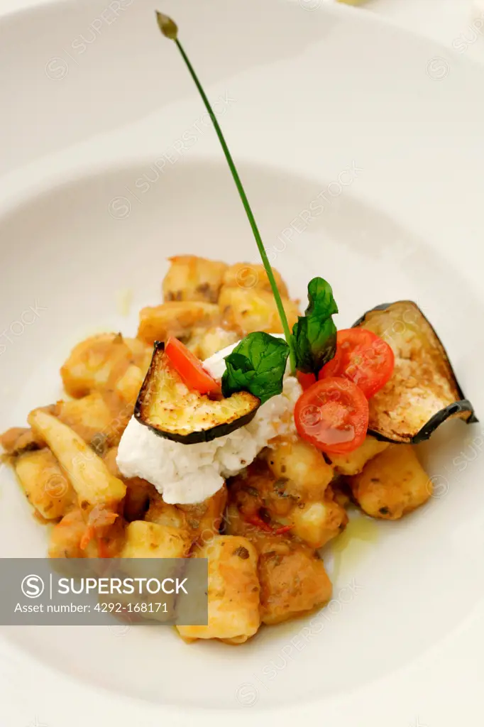 Italy, gnocchi with puree of eggplant, tomatoes and fresh ricotta