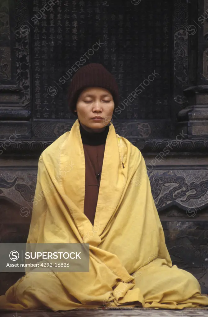 Woman praying -Vietnam, Hanoi. Chua Hung Pagoda