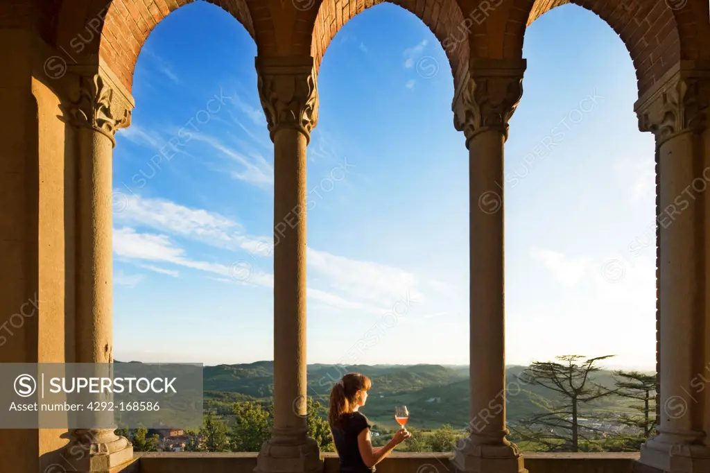 Italy, Piedmont, Monferrato, woman tasting wine at the Gabiano castle