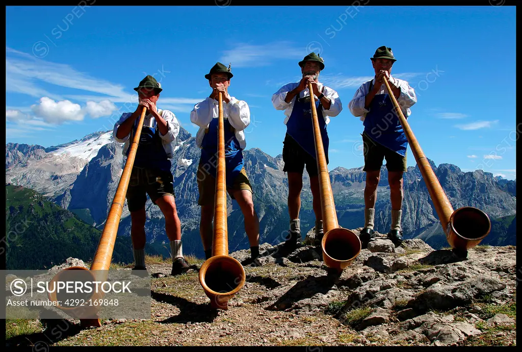 Italy, Trentino Alto Adige, Val di Fassa, men playing tradional instrument