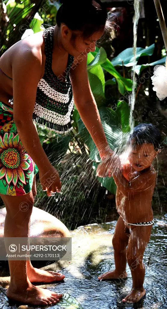 Central America, Panama, Embera Drua mother bathing son