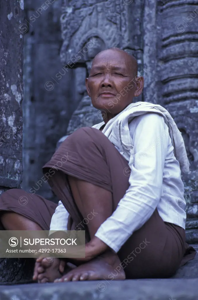 Man, portrait. Cambodia, Angkor, Bayon Prayers